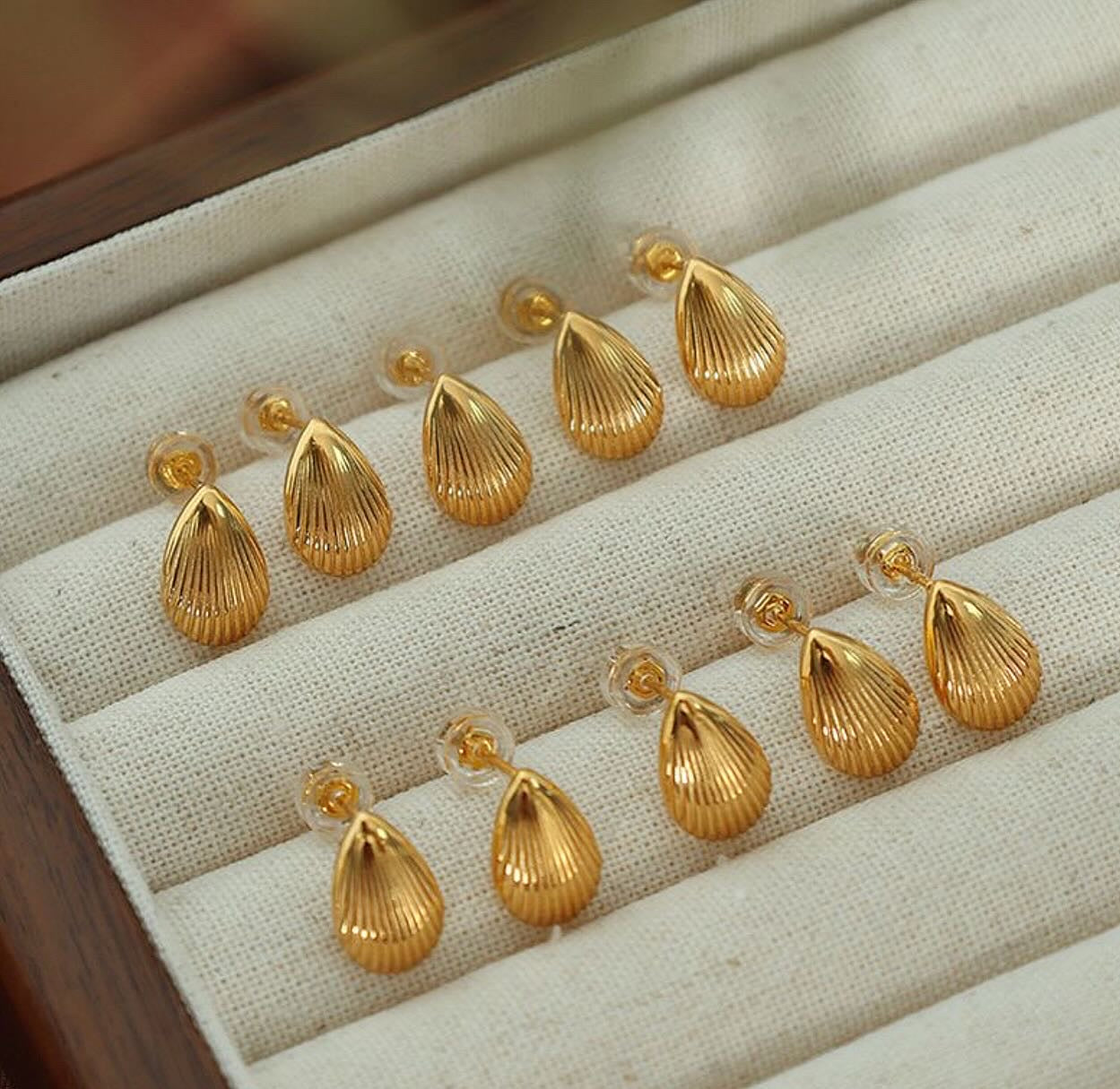 Brinco concha aço inoxidável